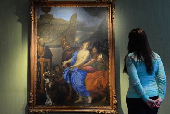 A Christies employee looks at an oil painting by 17th century artist Charles Le Brun 580x388 Masterpiece found at Ritz sold to New Yorks Metropolitan Museum of Art for $1.4 million